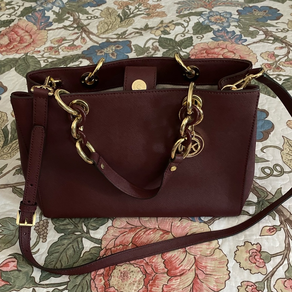 Michael Kors maroon satchel.